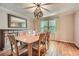 Elegant dining room with hardwood floors, classic decor, and stylish lighting, ideal for hosting gatherings at 3635 Norwich Dr, Tucker, GA 30084