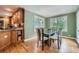 Inviting dining area with a glass table, comfortable seating, and large windows at 3635 Norwich Dr, Tucker, GA 30084