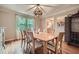 Formal dining room featuring hardwood floors, stylish light fixture, and seating for eight, perfect for entertaining at 3635 Norwich Dr, Tucker, GA 30084