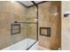 Bathroom featuring tile shower with glass door and built-in niches at 5250 Aubrey Ln, Cumming, GA 30028