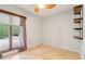Cozy room featuring tile floors, a window, and a shelf at 5250 Aubrey Ln, Cumming, GA 30028