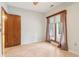 Bedroom featuring tile flooring, and a large window offering natural light at 5250 Aubrey Ln, Cumming, GA 30028