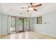 Bedroom boasting tile flooring and access to an outdoor patio and backyard at 5250 Aubrey Ln, Cumming, GA 30028