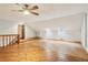 Bonus room with light blue walls and wood flooring at 5250 Aubrey Ln, Cumming, GA 30028