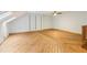 Bonus room with light blue walls and wood flooring at 5250 Aubrey Ln, Cumming, GA 30028