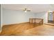 Bonus room with light blue walls and wood flooring at 5250 Aubrey Ln, Cumming, GA 30028