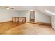 Bonus room with light blue walls and wood flooring at 5250 Aubrey Ln, Cumming, GA 30028