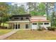 Two story house with white siding, a red roof, a black iron balcony, and a walkway at 5250 Aubrey Ln, Cumming, GA 30028