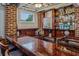 Basement bar featuring a wooden bar top, bar stools, and a bar refrigerator at 933 N Highland Ne Ave, Atlanta, GA 30306