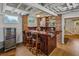 Basement bar featuring a wooden bar, bar stools, and a beverage refrigerator at 933 N Highland Ne Ave, Atlanta, GA 30306