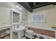 Basement bathroom featuring a pedestal sink, a toilet, and a checkerboard floor at 933 N Highland Ne Ave, Atlanta, GA 30306