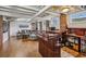 Finished basement with a wet bar, exposed brick, and ample seating, ideal for recreation at 933 N Highland Ne Ave, Atlanta, GA 30306