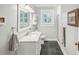 Bathroom featuring a white vanity, marble countertop, and a glass-enclosed shower at 933 N Highland Ne Ave, Atlanta, GA 30306