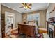 Bedroom with hardwood floors, a fireplace, and a large window with white trim at 933 N Highland Ne Ave, Atlanta, GA 30306