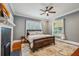 Comfortable bedroom with hardwood floors, a ceiling fan, and natural light at 933 N Highland Ne Ave, Atlanta, GA 30306
