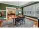 Open-concept dining room with a wooden table, rug, and a view into the living room at 933 N Highland Ne Ave, Atlanta, GA 30306
