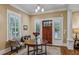 Inviting foyer with hardwood floors and large front door at 933 N Highland Ne Ave, Atlanta, GA 30306
