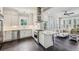 Modern kitchen featuring stainless steel appliances, a central island, and sleek dark floors at 933 N Highland Ne Ave, Atlanta, GA 30306