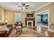 Cozy living room with fireplace, hardwood floors, and ample natural light at 933 N Highland Ne Ave, Atlanta, GA 30306