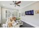 Cozy living room with a comfortable couch, shuttered windows, and plenty of light at 933 N Highland Ne Ave, Atlanta, GA 30306