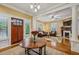 Spacious living room with hardwood floors, fireplace, and natural light at 933 N Highland Ne Ave, Atlanta, GA 30306