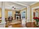 Elegant living room featuring a fireplace, detailed millwork, and hardwood floors, perfect for entertaining at 933 N Highland Ne Ave, Atlanta, GA 30306