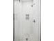 Modern bathroom shower featuring white subway tile, a mosaic tile floor, and a built-in niche at 933 N Highland Ne Ave, Atlanta, GA 30306