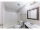 Bathroom with combination shower and tub, vanity with basin sink, and a framed mirror at 1060 S Millard Way, Stone Mountain, GA 30088
