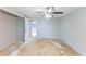 Bedroom showing a ceiling fan, door to closet, and window at 1060 S Millard Way, Stone Mountain, GA 30088