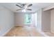 Bedroom with a window and ceiling fan with views of backyard at 1060 S Millard Way, Stone Mountain, GA 30088