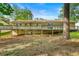 Back of house with wooden deck and spacious yard, perfect for outdoor living and entertaining at 1773 Kimberly Sw Dr, Marietta, GA 30008