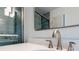Modern bathroom with a large mirror, sleek fixtures, and glass-enclosed shower at 1773 Kimberly Sw Dr, Marietta, GA 30008