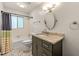 Well-lit bathroom features a sleek vanity, shower-tub combo, and stylish tile floors at 1773 Kimberly Sw Dr, Marietta, GA 30008