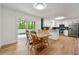 Bright eat-in kitchen features white cabinets, stainless steel appliances, and access to a backyard deck at 1773 Kimberly Sw Dr, Marietta, GA 30008
