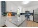Updated kitchen featuring granite countertops, stainless steel appliances, and a subway tile backsplash at 1773 Kimberly Sw Dr, Marietta, GA 30008