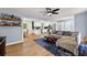 Spacious living area with hardwood floors, bar shelves, open to dining area and updated kitchen at 1773 Kimberly Sw Dr, Marietta, GA 30008