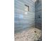 Close-up of a beautifully tiled shower with hexagon tile floor and built in niche at 1773 Kimberly Sw Dr, Marietta, GA 30008