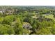 Aerial view of the home surrounded by lush greenery and trees at 922 Florence Rd, Douglasville, GA 30134