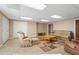 Finished basement with tiled floors, recessed lighting, comfortable seating, and ample space for entertaining at 922 Florence Rd, Douglasville, GA 30134