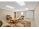 Large basement featuring an area rug, plush seating, and double doors at 922 Florence Rd, Douglasville, GA 30134