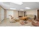 Spacious basement featuring tiled flooring, ample seating, and recessed lighting at 922 Florence Rd, Douglasville, GA 30134