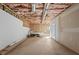 Unfinished basement framed for remodeling with exposed ducts, and concrete floors at 922 Florence Rd, Douglasville, GA 30134