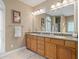 Bathroom with double vanity, granite countertop and a framed mirror at 922 Florence Rd, Douglasville, GA 30134