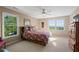 Bright bedroom with large windows offering scenic views and ceiling fan at 922 Florence Rd, Douglasville, GA 30134