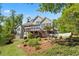 Beautiful two-story home with a large deck, screened porch, fenced yard, and well-manicured landscaping at 922 Florence Rd, Douglasville, GA 30134