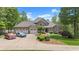 Charming two-story home features a three-car garage, stone accents and beautifully landscaped front yard at 922 Florence Rd, Douglasville, GA 30134