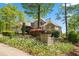 Charming home with a manicured front yard featuring blooming flowers and lush greenery at 922 Florence Rd, Douglasville, GA 30134