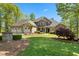 Elegant home with a three-car garage, landscaped front yard, and stone accents at 922 Florence Rd, Douglasville, GA 30134