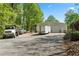 Large metal outbuilding with ample parking space for vehicles, equipment, and storage needs at 922 Florence Rd, Douglasville, GA 30134