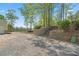 Driveway with stone stairway near the garage, adding landscape features to the property at 922 Florence Rd, Douglasville, GA 30134